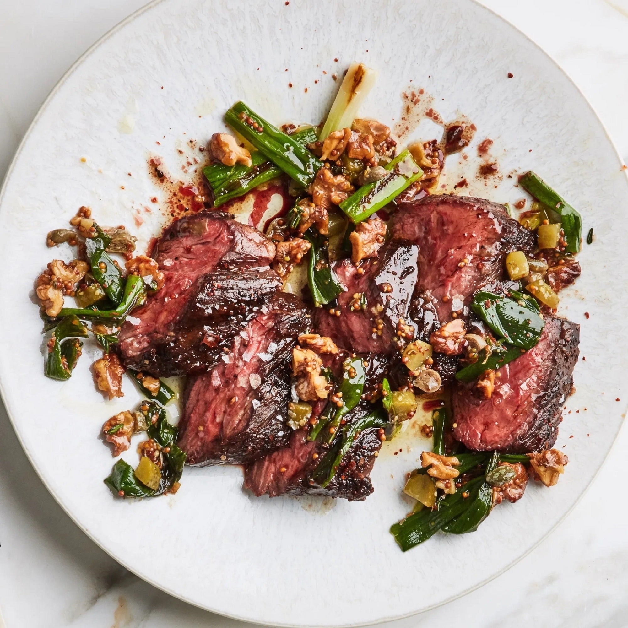 CHARRED STEAK WITH SCALLION AND TOASTED WALNUTS